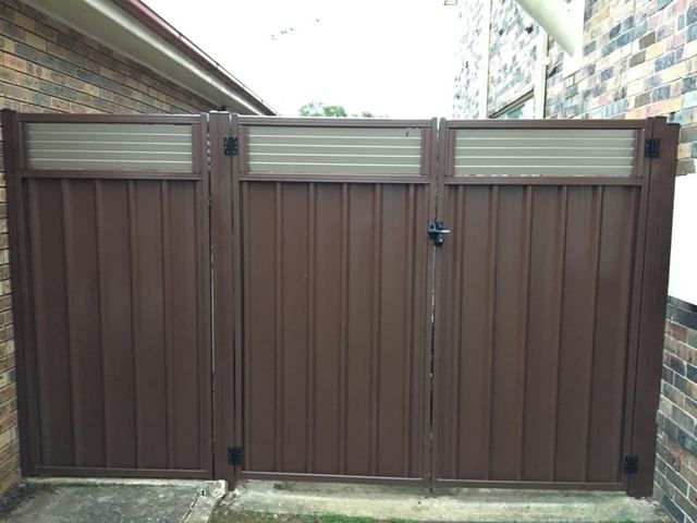Colorbond double gate with louvre inserts and a fixed Colorbond panel with louvre inserts