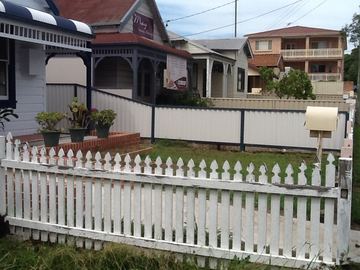 A mid grey Colorbond fence on a residential boundary