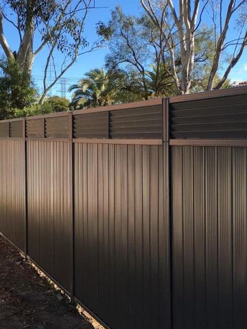 Installed Colorbond sheets forming a privacy boundary.