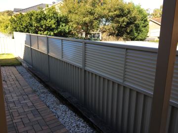 Installed Colorbond sheets forming a privacy boundary.