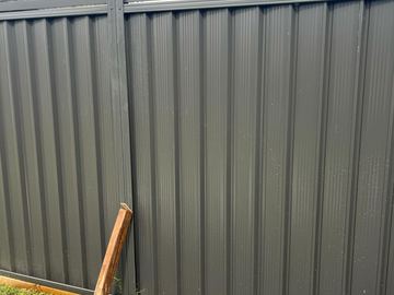 Close view of mid grey Colorbond corrugated sheets showing the rib profile