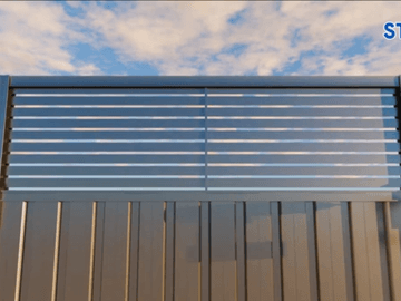 Close view of a charcoal Colorbond fence with a horizontal louvre topper