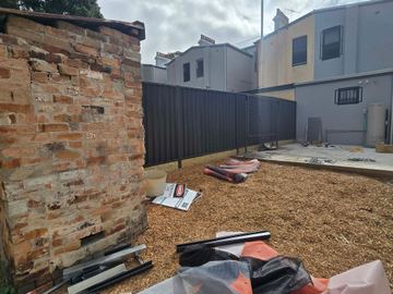 New treated pine palings on a residential block.