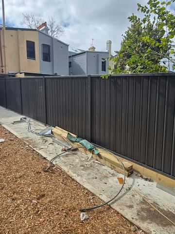 New treated pine palings on a residential block.