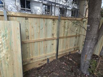 New treated pine palings on a residential block.