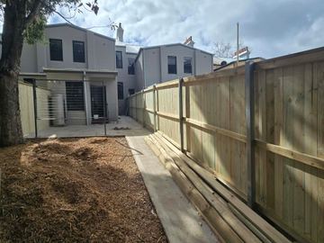 New treated pine palings on a residential block.