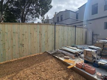 New treated pine palings on a residential block.