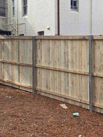 New treated pine palings on a residential block.