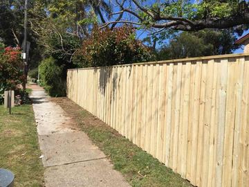 New treated pine palings on a residential block.