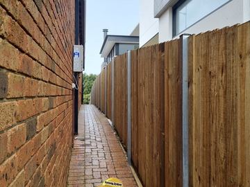 New treated pine palings on a residential block.