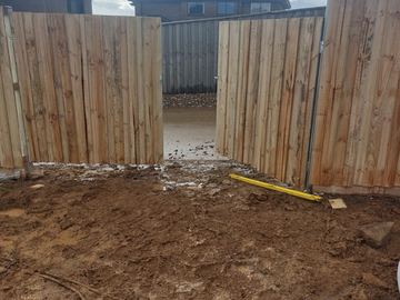 New treated pine palings on a residential block.