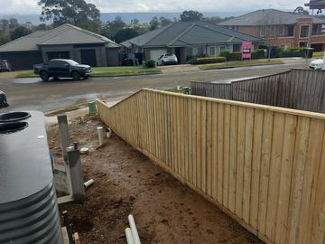 New treated pine palings on a residential block.
