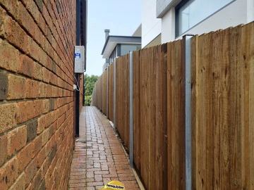 New treated pine palings on a residential block.